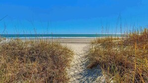A beach path leading to the ocean with clear skies. - Windy Shores II - 305 (North Myrtle Beach)