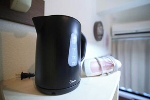 A black electric kettle on a white countertop with a control panel. - Near the station / Quiet area / Shinjuku center / Room 203 (Shinjuku City)