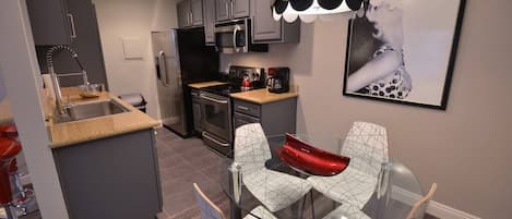 Coffee/tea maker, fridge, microwave, oven