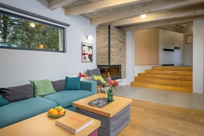 A modern living room with a sofa, coffee table, and a book titled 'NEUTRA'. - Villa Casa LaBobina (Istria - Kurili) (Kurili)