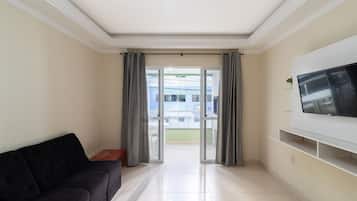 Basic Apartment | Living area | 40-inch TV with digital channels