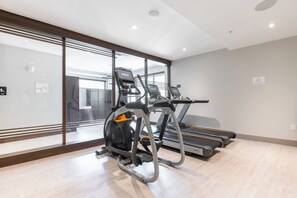 A gym with treadmills and an elliptical machine. - True Ski In /Out Lift 2 BD Epic Views, Amazing Amenities; Steps to Gondola (Park City)