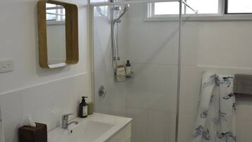 Shower, towels, soap, toilet paper