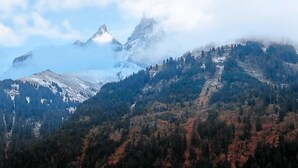 A mountain landscape with snow-covered peaks and a forested valley. - Chalet François, (Champery). by Interhome (Champery)
