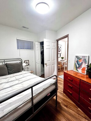 A bedroom with a bed, a wardrobe, a desk, and a chair. - A quiet stay in Toronto Waterfront Neighbourhood. Walk to the beach. (Toronto)