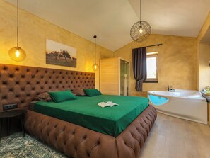 A bedroom with a tufted headboard, a green bedspread, a bedside table, a hanging light fixture, and a window with curtains. - Villa Maslina by Interhome (Dracevac)