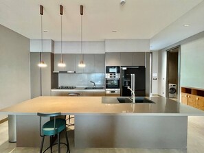 Standard Apartment, 1 King Bed with Sofa bed, Balcony, Courtyard View | Private kitchen - TheCommune (Phnom Penh)