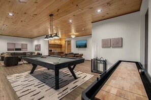 A modern living room with a pool table, a billiards rack, and a ping pong table. - Views/HotTub/GameRoom/2FirePits/3Masters/Sleeps10! (Sevierville)