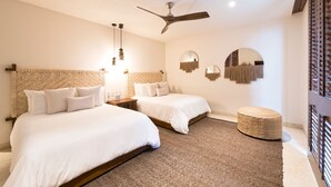 A hotel room with two beds, a ceiling fan, wall-mounted mirrors, and a woven ottoman. - Condo Ensue o 3BD - Tau Punta Mita (Punta de Mita)