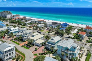 A coastal residential area with beachfront properties, roads, and a clear view of the ocean. - Steps2 Beach/Gulf Views/Heated Pool&Spa/Golf Cart (Destin)