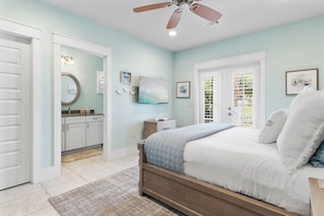 A bedroom with a bed, a nightstand, a ceiling fan, and a window with blinds. - Steps2 Beach/Gulf Views/Heated Pool&Spa/Golf Cart (Destin)