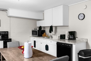 Start your day with coffee or wind down with a home-cooked meal—Unit B's kitchen comes ready with the appliances and essentials you need.