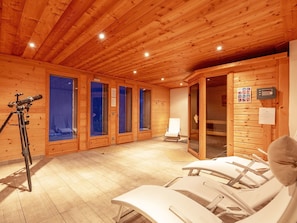 A wooden room with a sauna, a massage table, and a telescope. - Chalet Cairn by Interhome (Peisey-Nancroix)