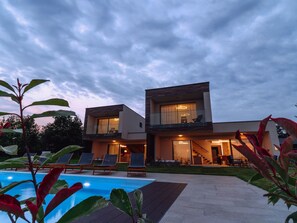 A modern two-story house with a swimming pool, outdoor seating, and a well-maintained garden. - House Iris Croatica by Interhome (Oroslavje)