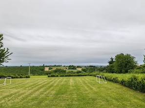 A grassy field with two soccer goals and a hedge. - House Blackberry Hill by Interhome (Kupinovac)