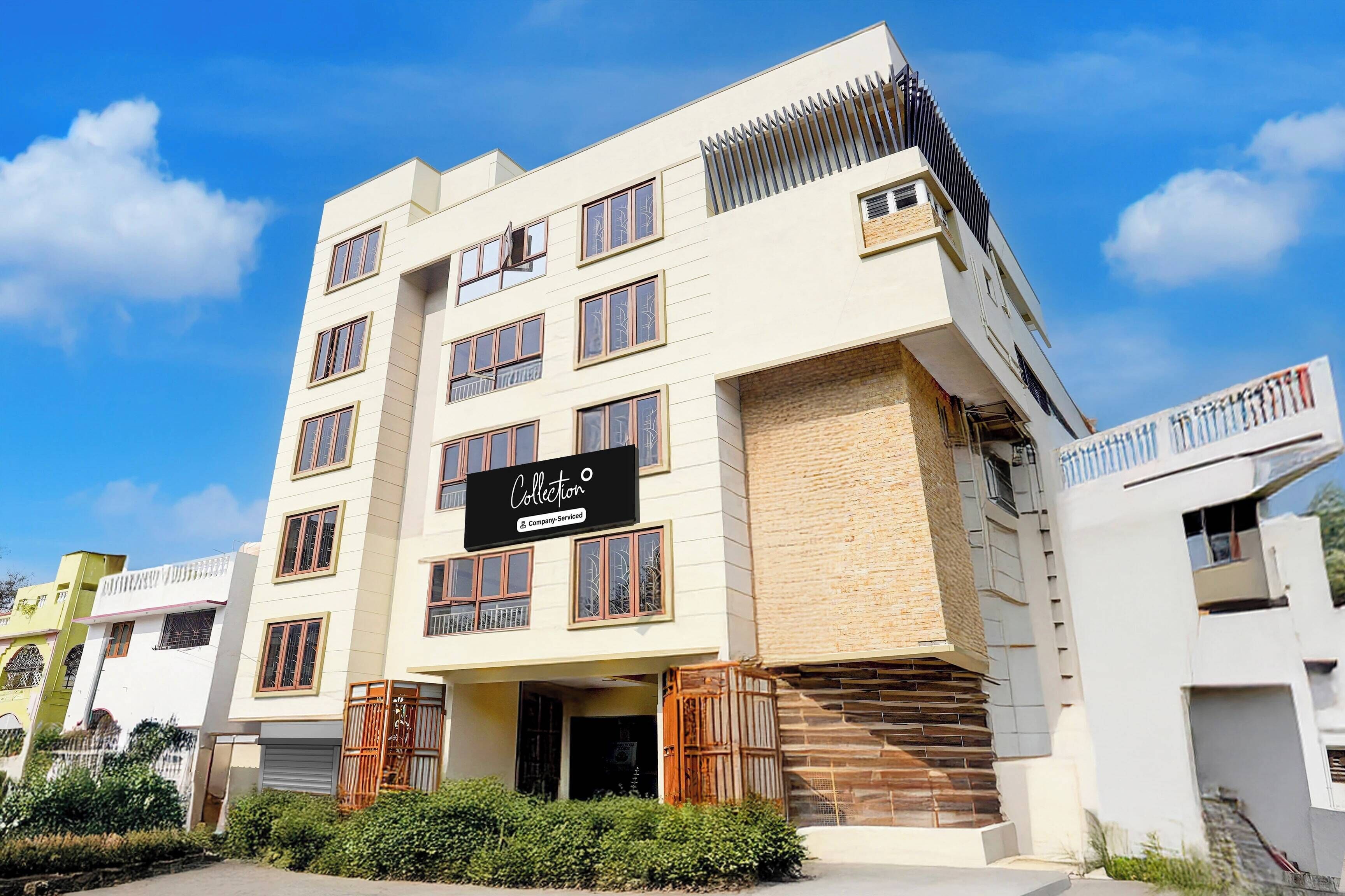 A multi-story building with a sign indicating it is a serviced company property.