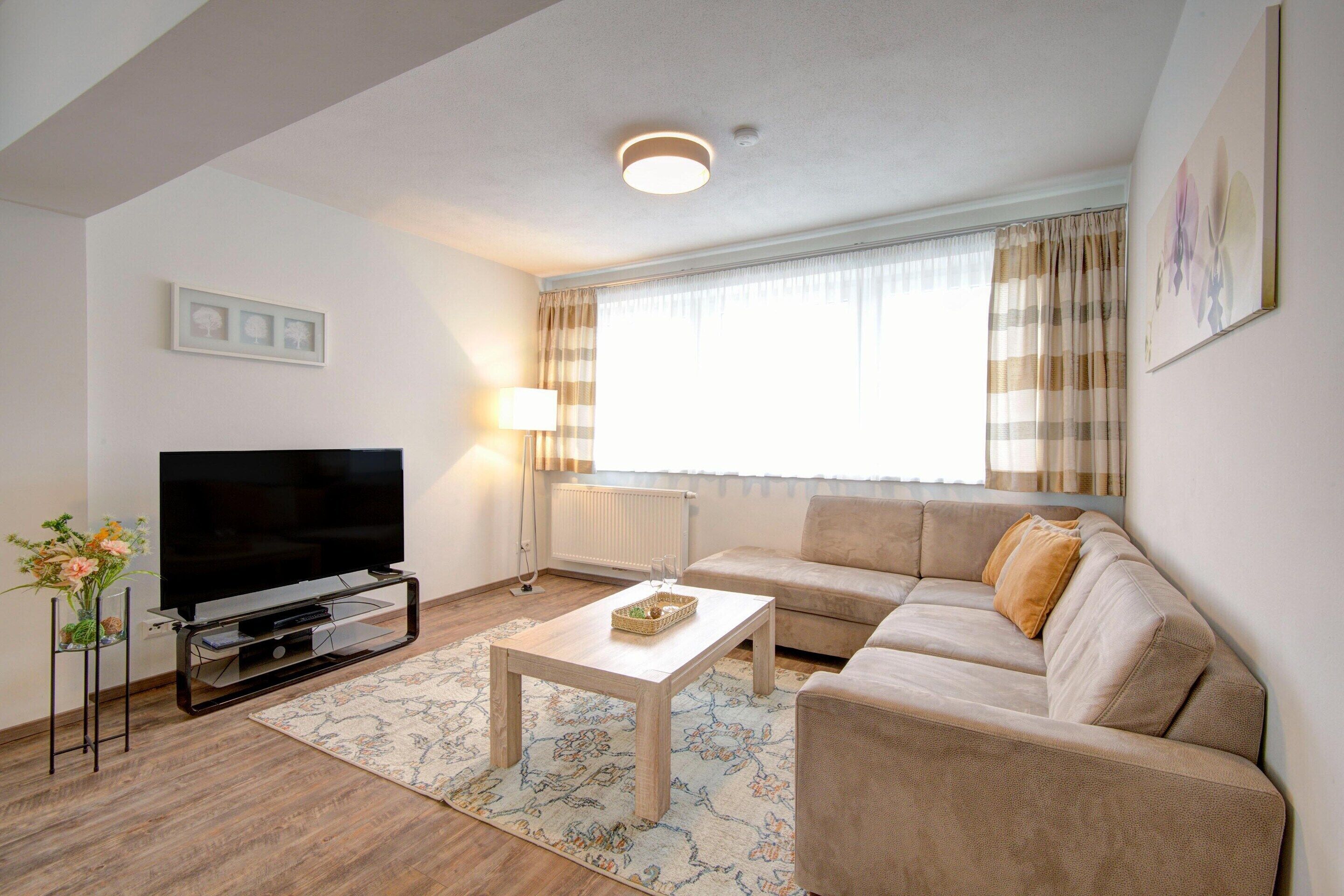 Deluxe Apartment, 2 Bedrooms | Living room | DVD player