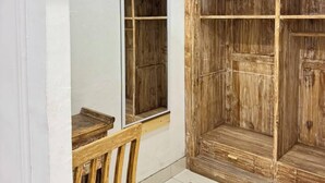 A room with a wooden wardrobe, a mirror, and a chair. - private room with bigger size room, near central canggu,
10minute to the beach (badung)