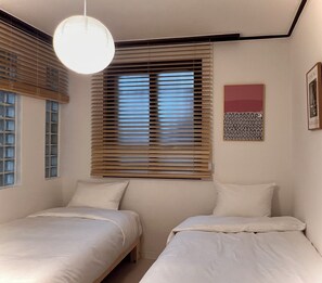 Habitación estándar con 2 camas individuales | Cortinas blackout y wifi gratis 