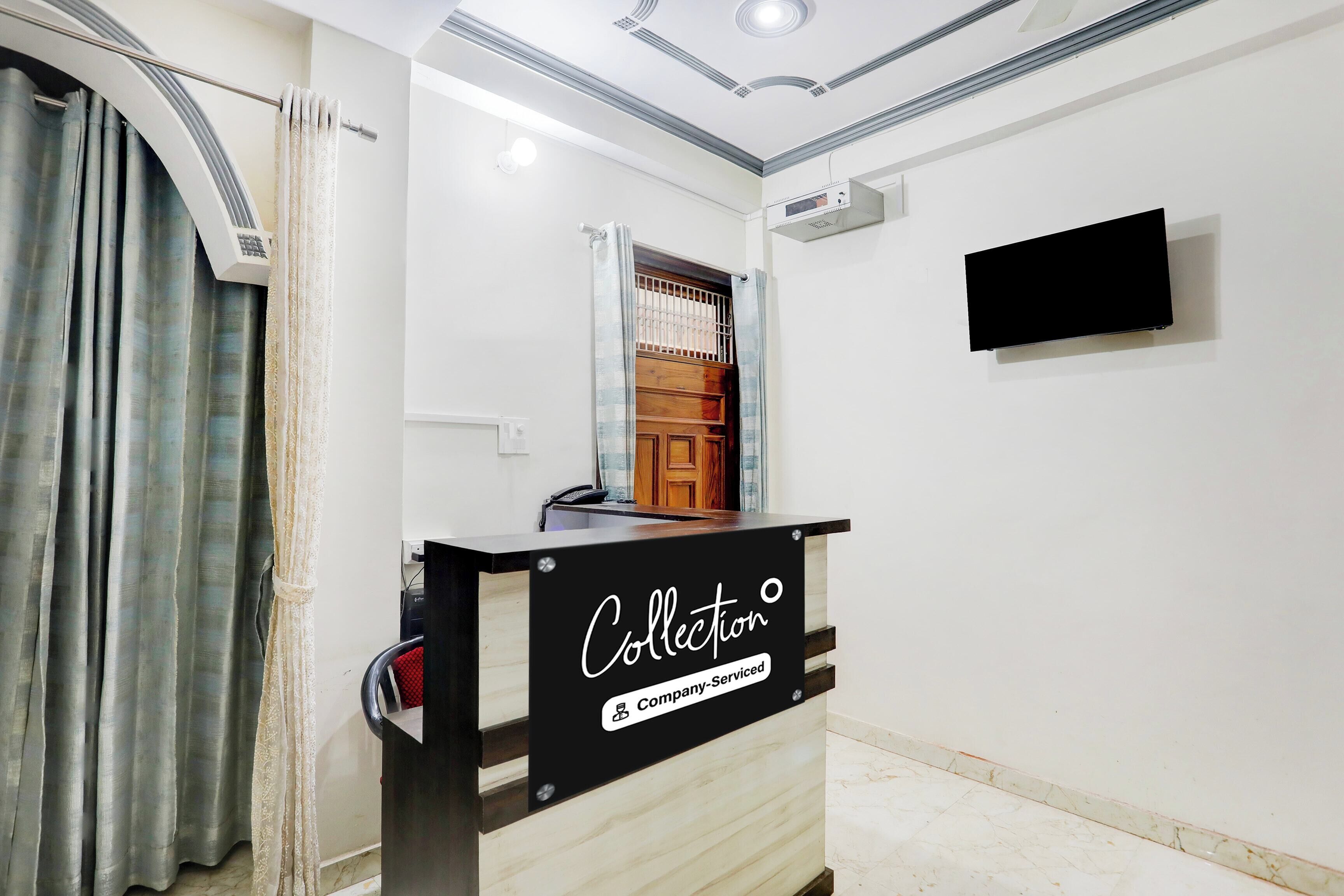 A reception desk with a sign reading 'Collection Company-Service'.