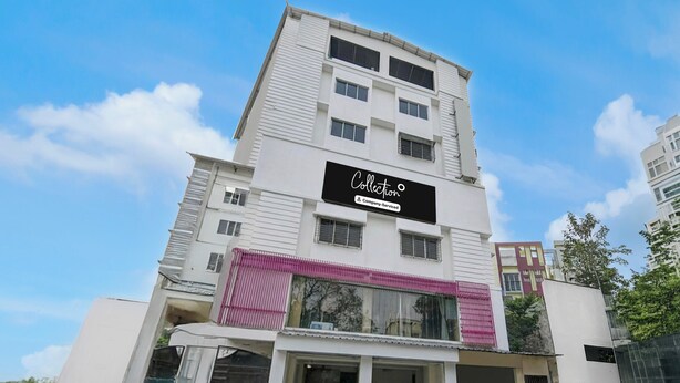 A multi-story building with a prominent sign indicating it is a company-serviced collection. - Collection O Park Street Road (Kolkata)