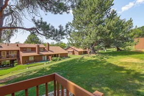 A residential area with multiple two-story houses, each with a front porch and a small yard. - Tasteful Townhome Near Black Hills National Forest (Rapid City)