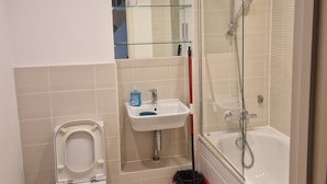 A bathroom with a toilet, sink, and shower. - A friendly budget room that delivers comfort stay (Woolston)