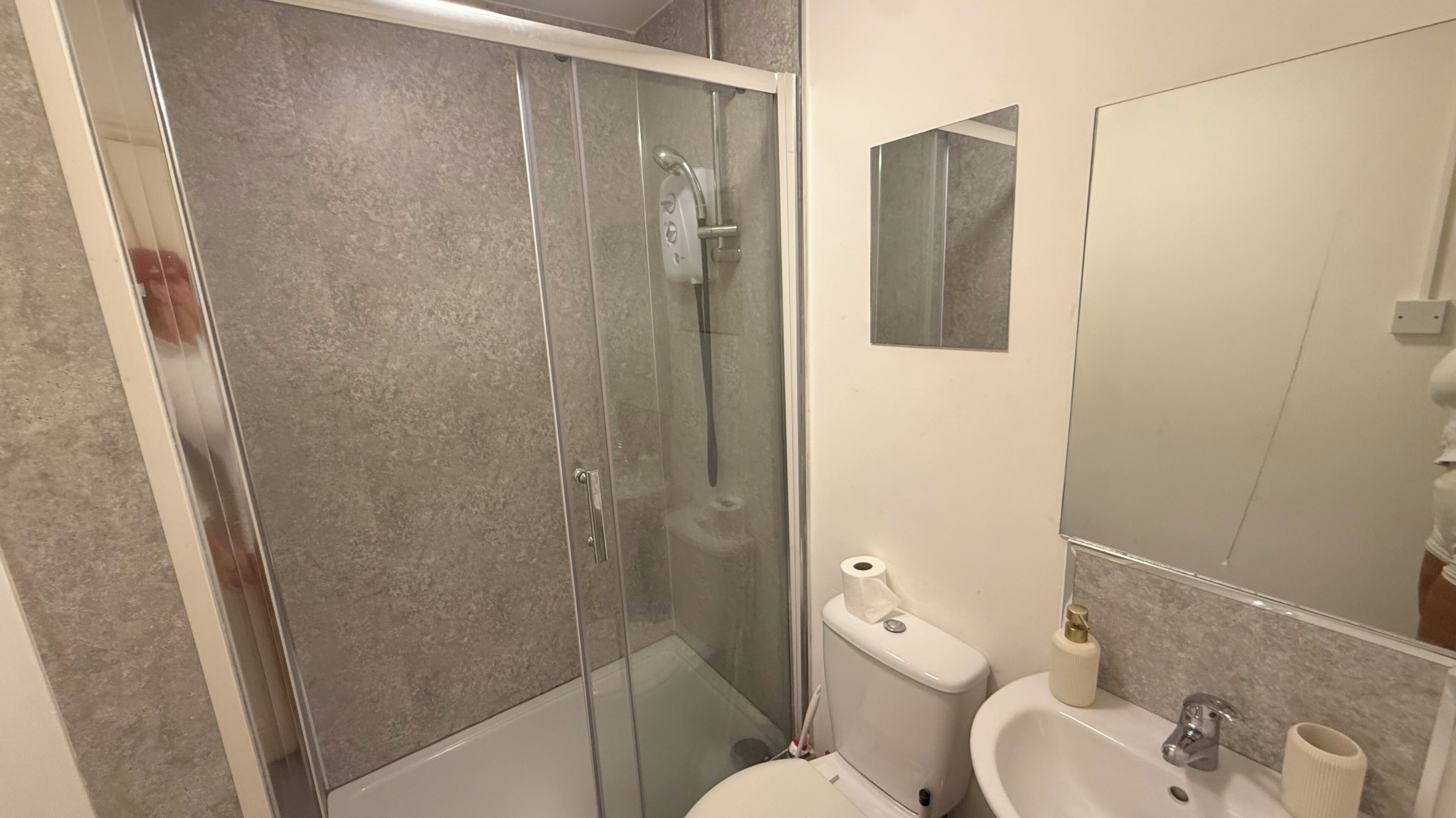 Shower, towels, soap, toilet paper