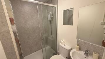 Shower, towels, soap, toilet paper