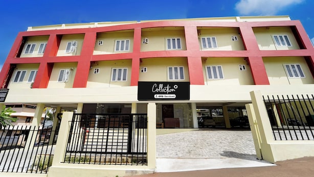 A multi-story building with a sign indicating it is serviced by OYO. - Super Collection O Kottayam (Kottayam)
