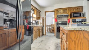A kitchen with wooden cabinets, a stainless steel refrigerator, a microwave, and a stove. - Private Yard & Patio! Overland Park Group Getaway (Overland Park)