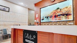 A reception desk with a sign reading 'Collection Company-Serviced'. - Super Collection O Chet Singh Ghat (Varanasi)