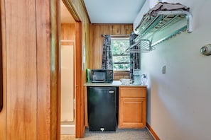 A compact kitchen with a microwave, coffee maker, and a small refrigerator. - Lake Champlain Waterside Retreat w/ Dock Access (Willsboro)