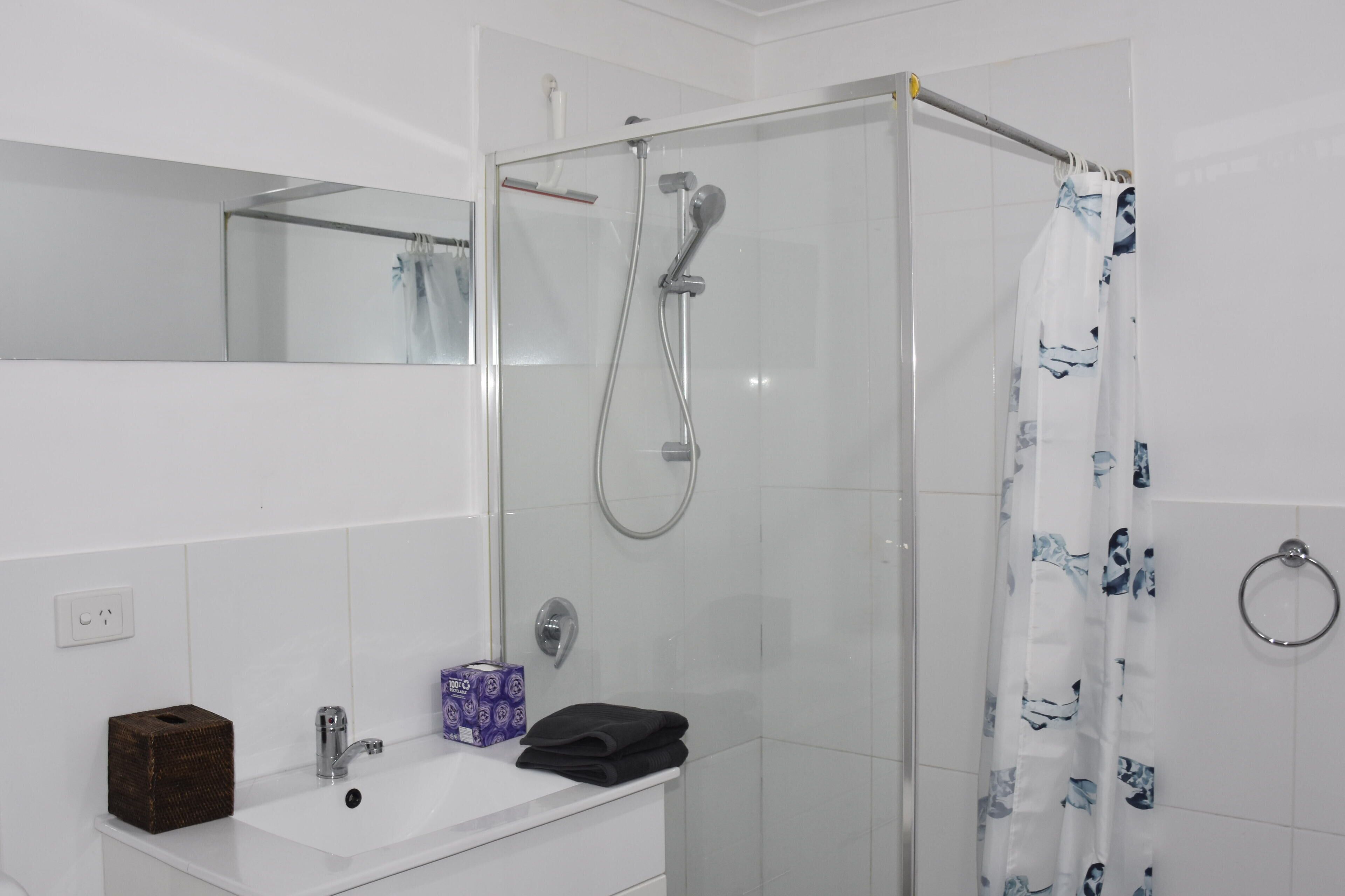Shower, towels, soap, toilet paper