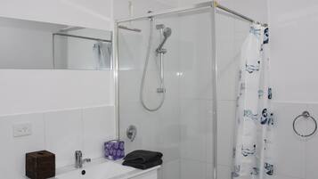 Shower, towels, soap, toilet paper