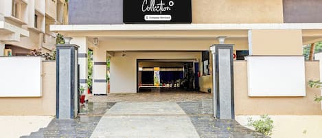 A building entrance with a sign reading 'Collection Company-Serviced'.