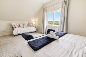 A hotel room with two beds, a large window with curtains, and a view of the outdoors. - Greystone Lavender Farm-Hot Tub|Pool Table|KoiPond (Meaford)
