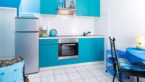 A compact kitchen with a refrigerator, stove, oven, and a sink. - Lovely apartment in Seget Vranjica with WiFi (Seget Vranjica)