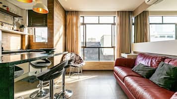 Basic Apartment | Living area | 40-inch TV with digital channels