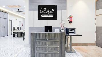 A reception desk with a sign that reads 'Collection Company-Serviced'.