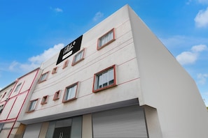 A multi-story building with a sign indicating it is a company-owned establishment.