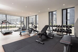 A gym with treadmills, elliptical machines, a bench, and a rack of dumbbells. - Student Only Causeway View (Aberdeen)