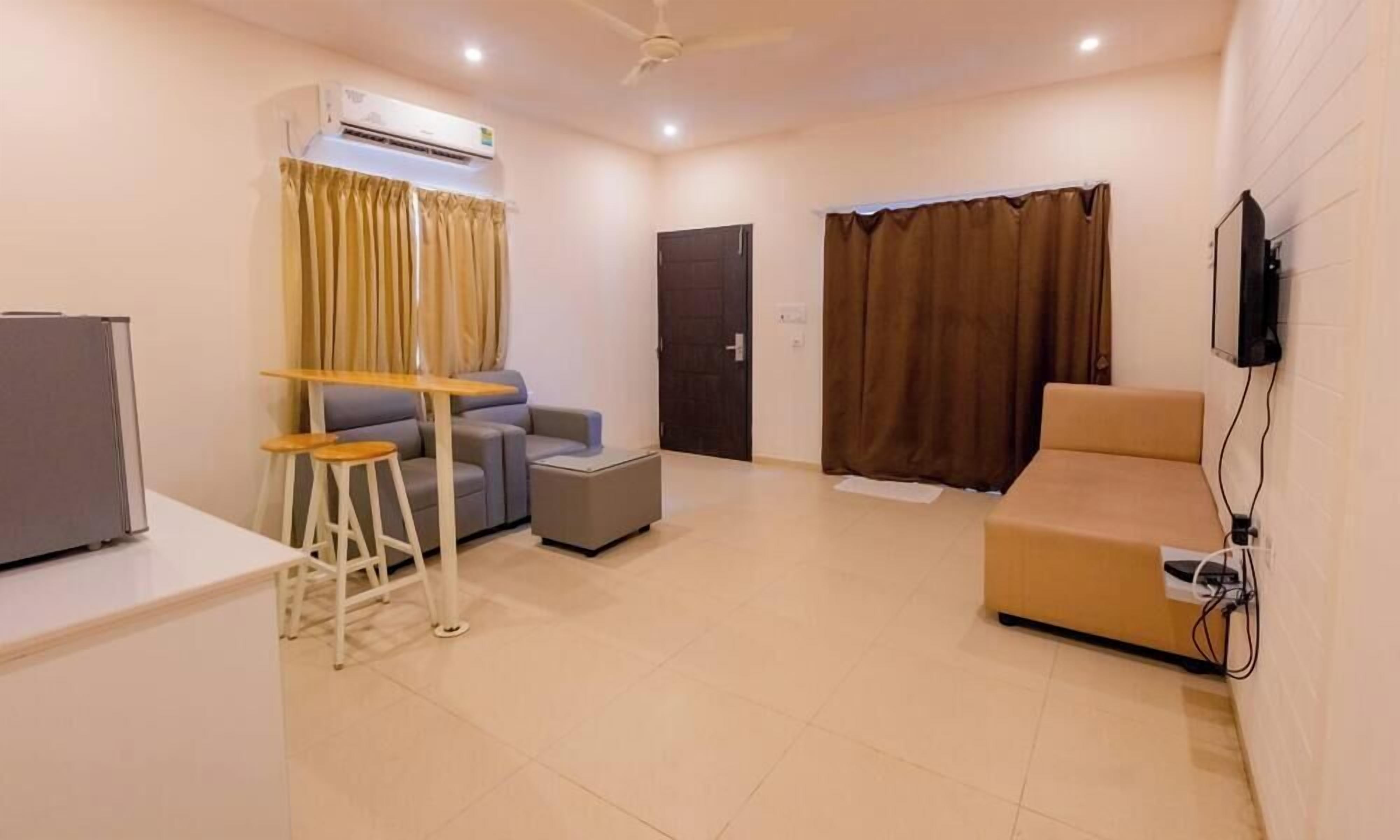 Premium Duplex | Living area | 32-inch LCD TV with cable channels