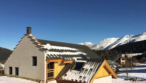A chalet with a sloped roof, a chimney, and a satellite dish. - Chalet la Vercouline 5***** (VILLARD DE LANS)