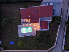 A two-story house with a swimming pool and a covered patio area. - Villa Eva by Interhome (Pula/Banjole)
