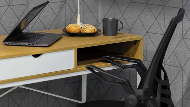 A modern office setup with a laptop, a desk lamp, a mug, and a black office chair. - Unique Studio for 2 Persons | Pet Friendly (Warszawa)