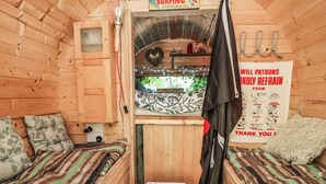 A cozy cabin with a surf-themed sign, a heart-shaped decoration, and a 'Will Patrons Kindly Refrain From' sign. - Cool Cabin (Leek)