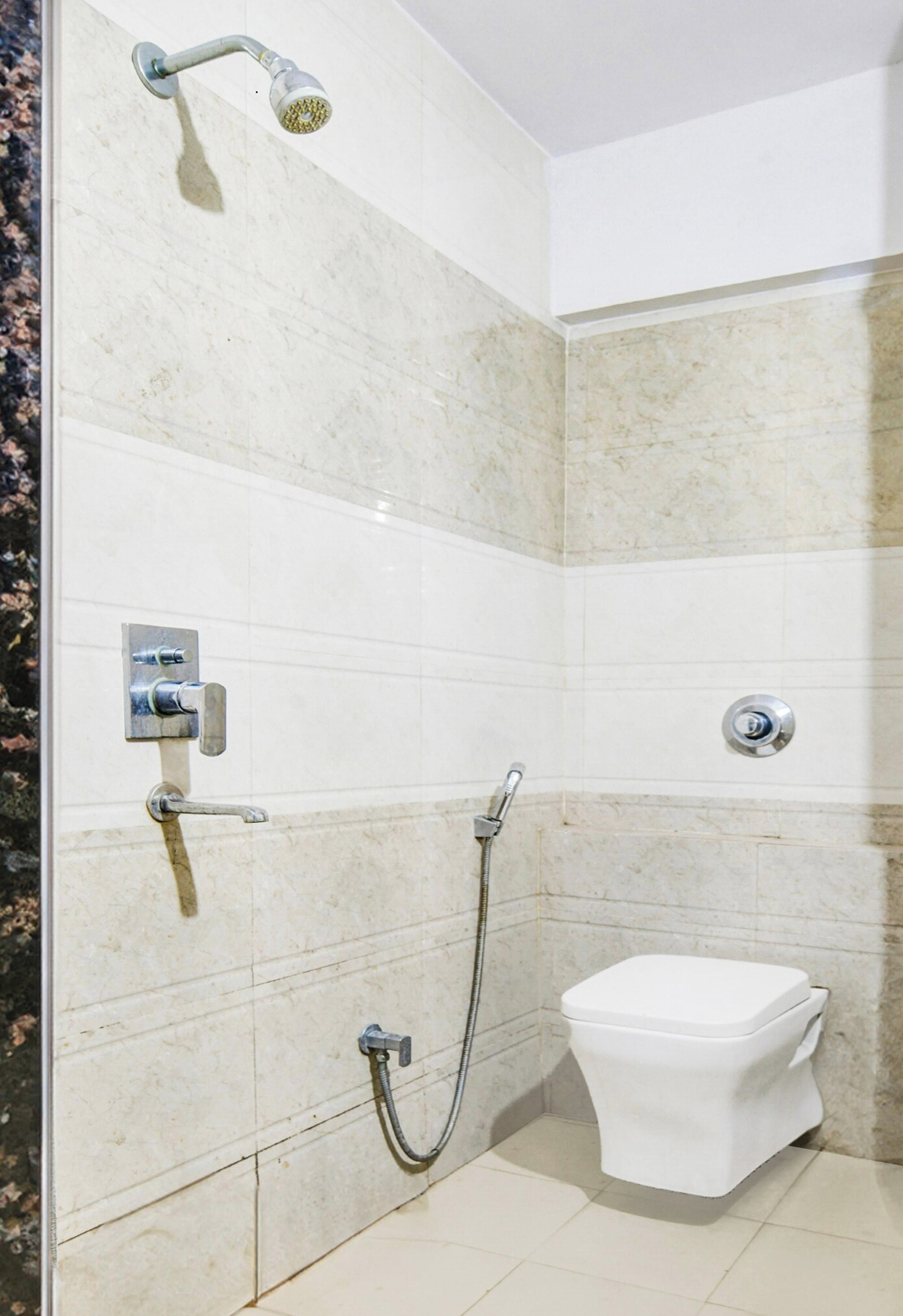 Shower, towels, shampoo, toilet paper