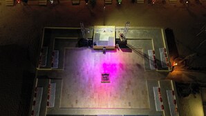 An aerial view of a hotel lobby with a central stage, seating areas, and a decorative centerpiece. - Experience the Best Jaisalmer Desert Safari & Luxury Camp Stay (Jaisalmer)