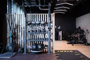 A gym with weightlifting equipment, treadmills, and cardio machines. - Student Only Centre Court (Nottingham)